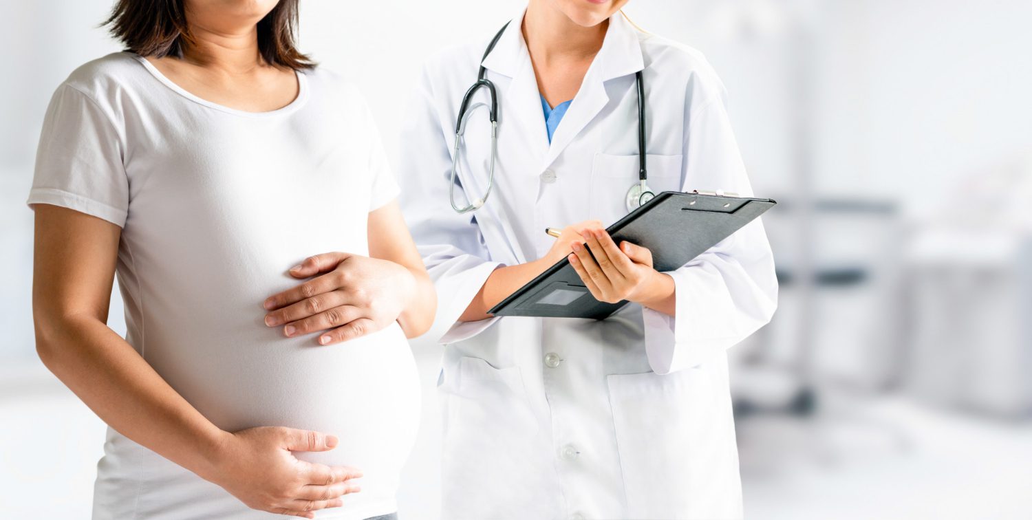 Pregnant woman and gynecologist doctor at hospital Pregnant woman and gynecologist doctor at hospital<br />